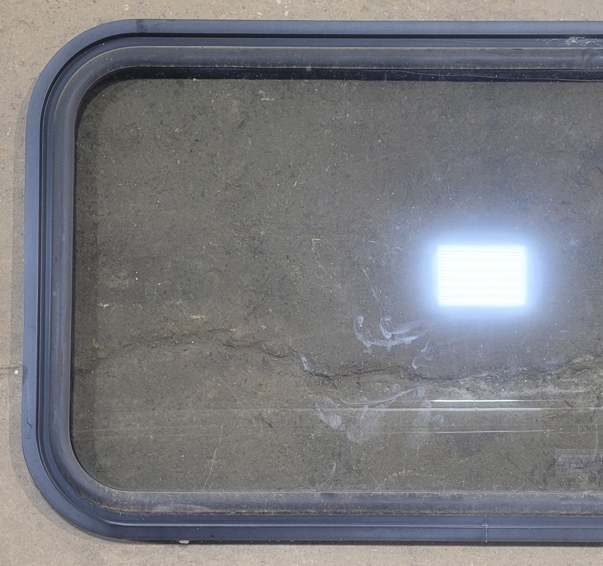 Used Black Radius Emergency Opening Window : 47 1/4" W x 25 1/2" H x 1" - Young Farts RV Parts