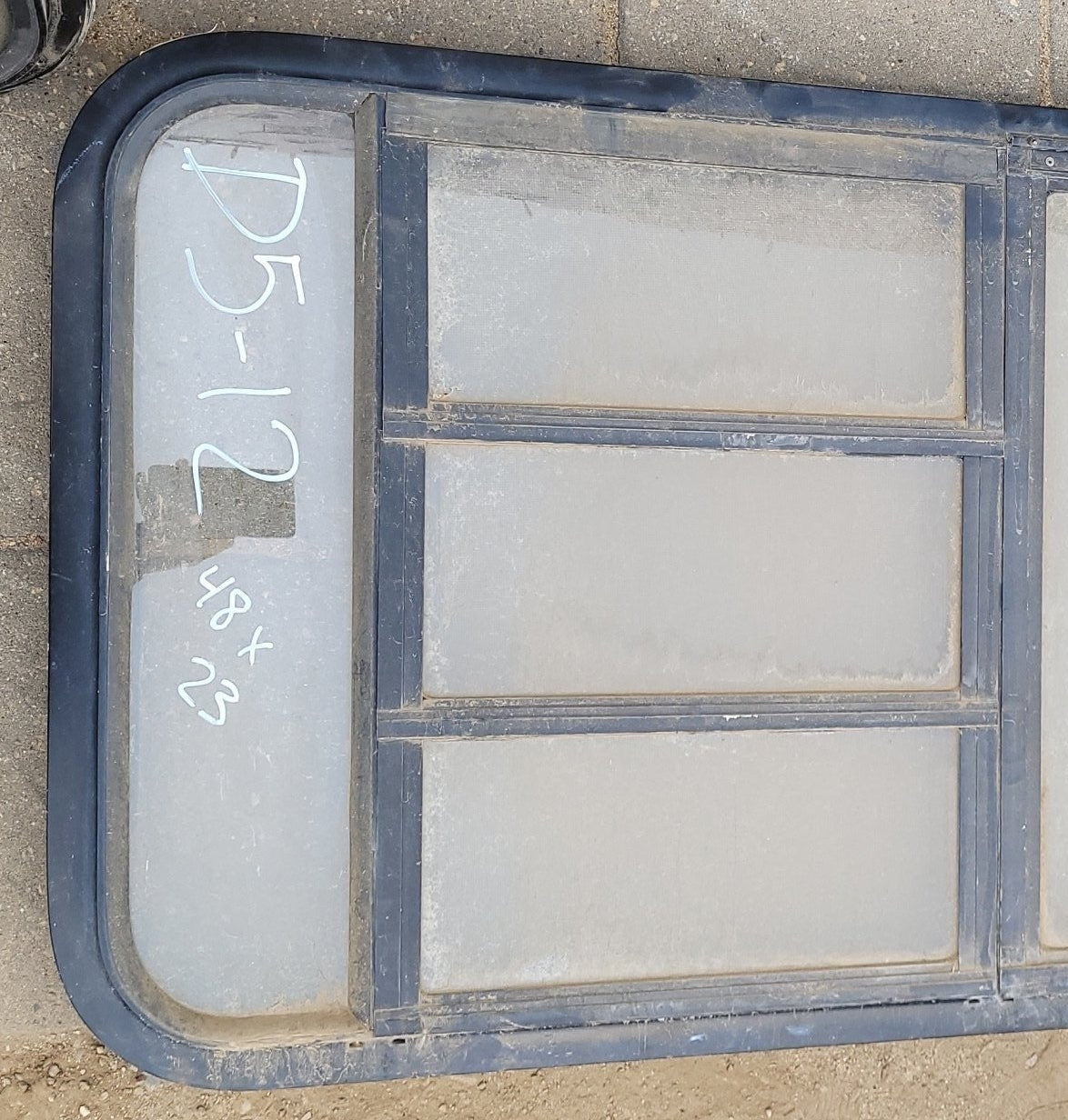 Used Black Radius Emergency Opening Window : 48 x 23 x 2" D - Young Farts RV Parts