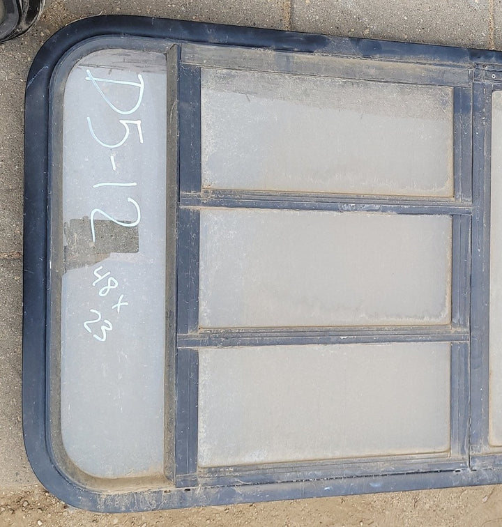 Used Black Radius Emergency Opening Window : 48 x 23 x 2" D - Young Farts RV Parts