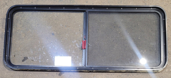 Used Black Radius Emergency Opening Window : 54 1/4" W x 21 3/4" H x 1 3/4" - Young Farts RV Parts