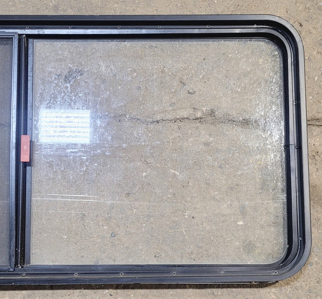 Used Black Radius Emergency Opening Window : 55 1/4" W x 25 1/2" H x 1 7/8" - Young Farts RV Parts