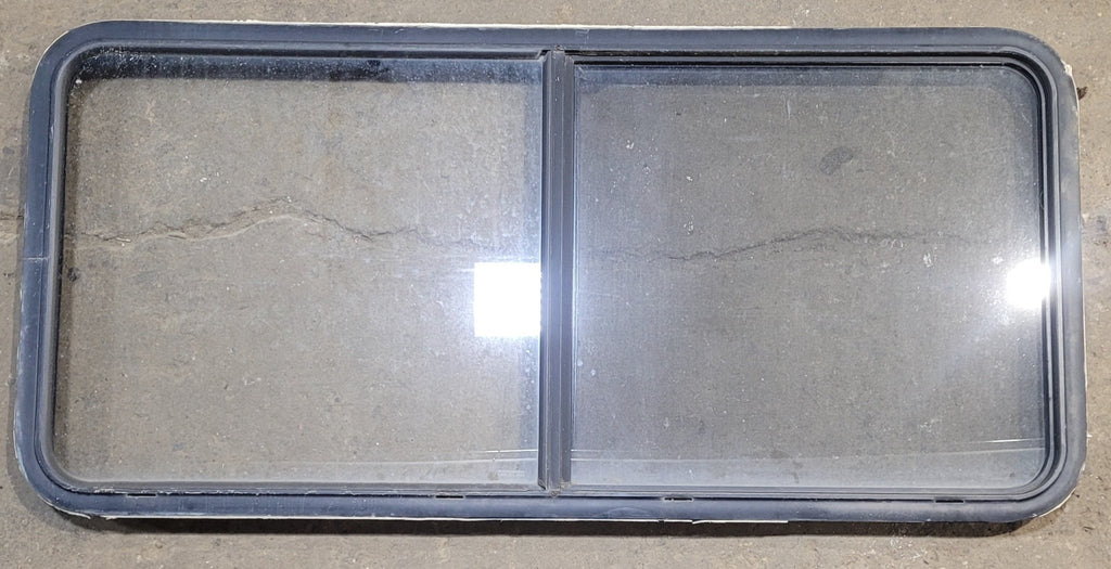 Used Black Radius Emergency Opening Window : 55 1/4" W x 25 1/2" H x 1 7/8" - Young Farts RV Parts