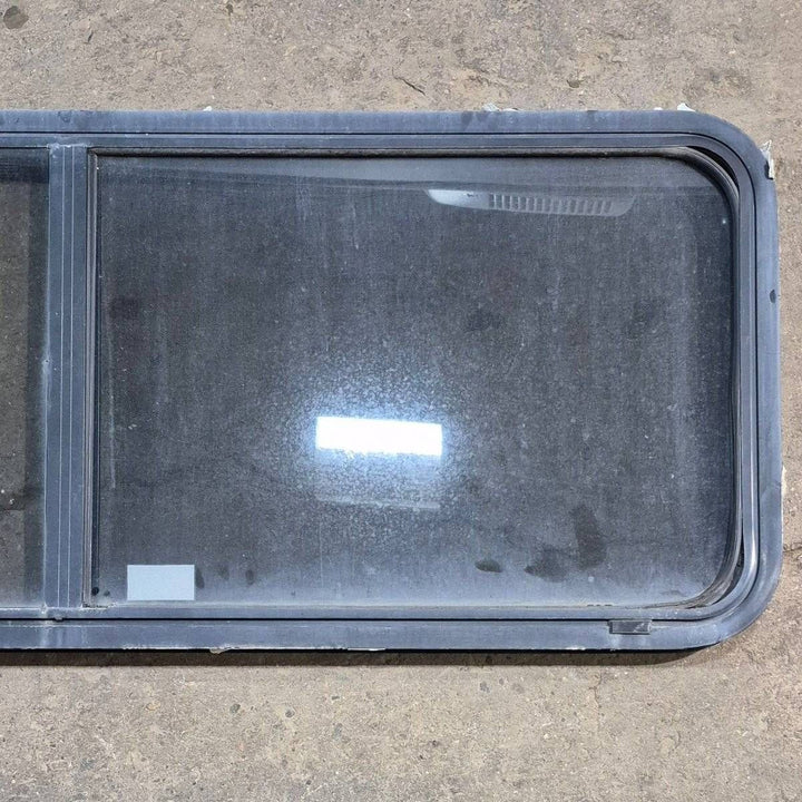 Used Black Radius Emergency Opening Window - 60 X 21.75 X 1.875 - Young Farts RV Parts
