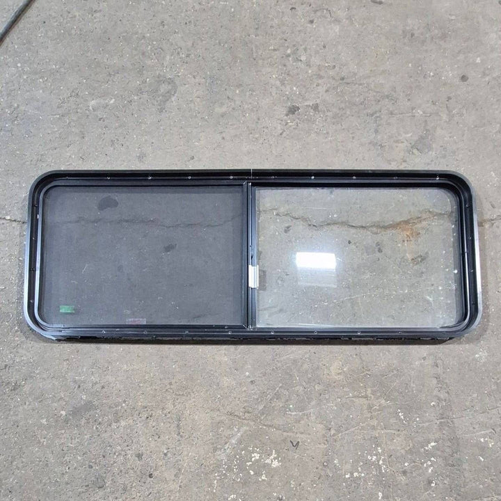 Used Black Radius Emergency Opening Window - 60.25 X 21.75 X 1.75 - Young Farts RV Parts