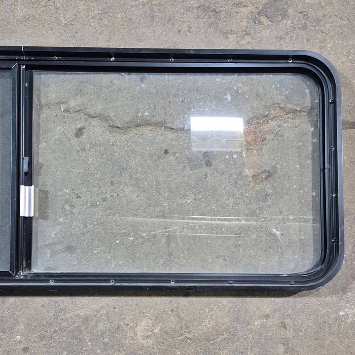 Used Black Radius Emergency Opening Window - 60.25 X 21.75 X 1.75 - Young Farts RV Parts