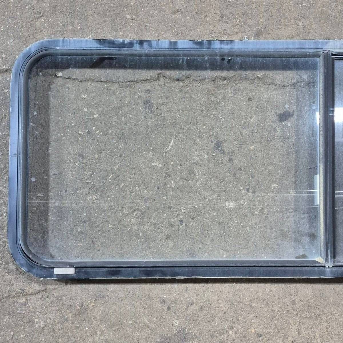 Used Black Radius Emergency Opening Window - 60.25 X 21.75 X 1.75 - Young Farts RV Parts