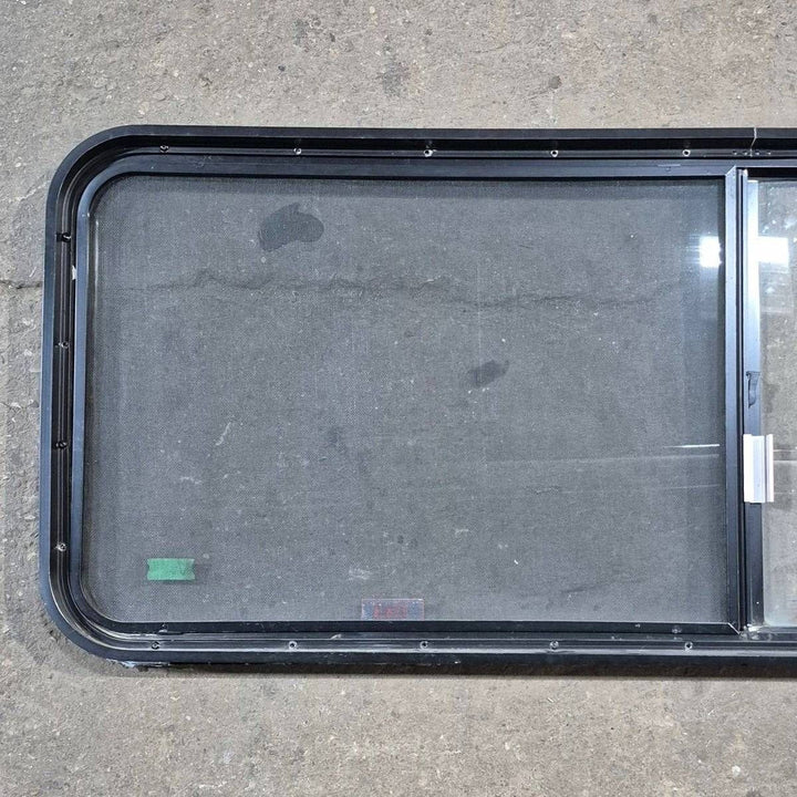 Used Black Radius Emergency Opening Window - 60.25 X 21.75 X 1.75 - Young Farts RV Parts
