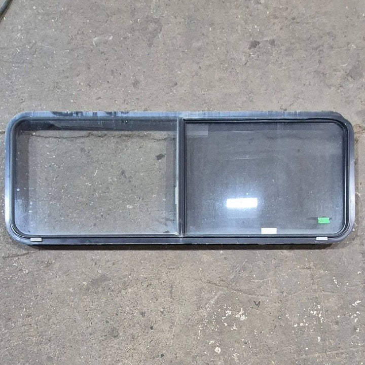 Used Black Radius Emergency Opening Window - 60.25 X 21.75 X 1.75 - Young Farts RV Parts