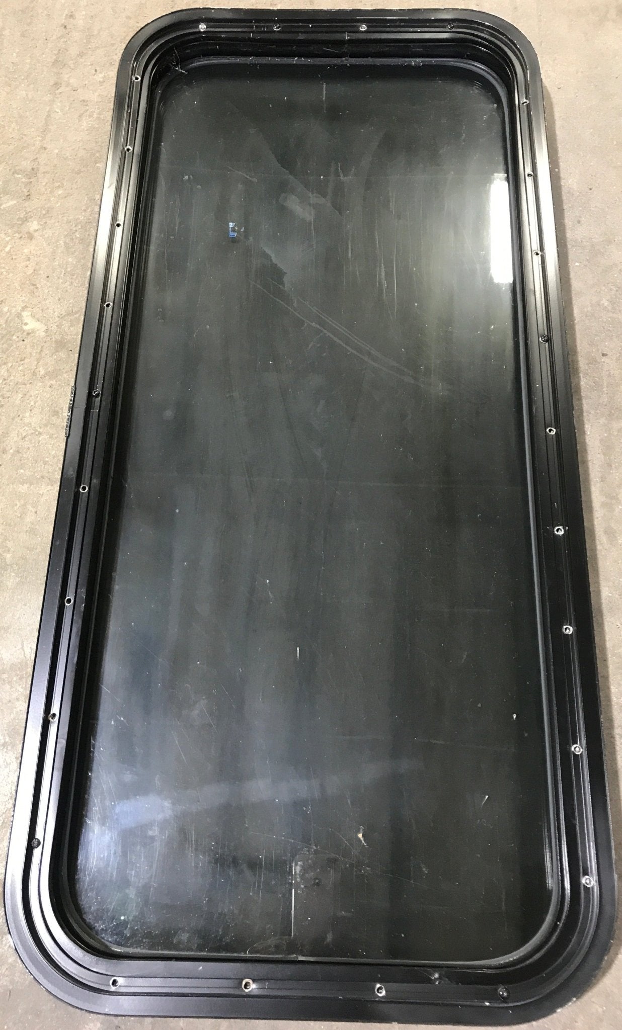 Used Black Radius Non Opening Window : 17 1/2" W x 39 1/2" H x 1 7/8" D - Young Farts RV Parts