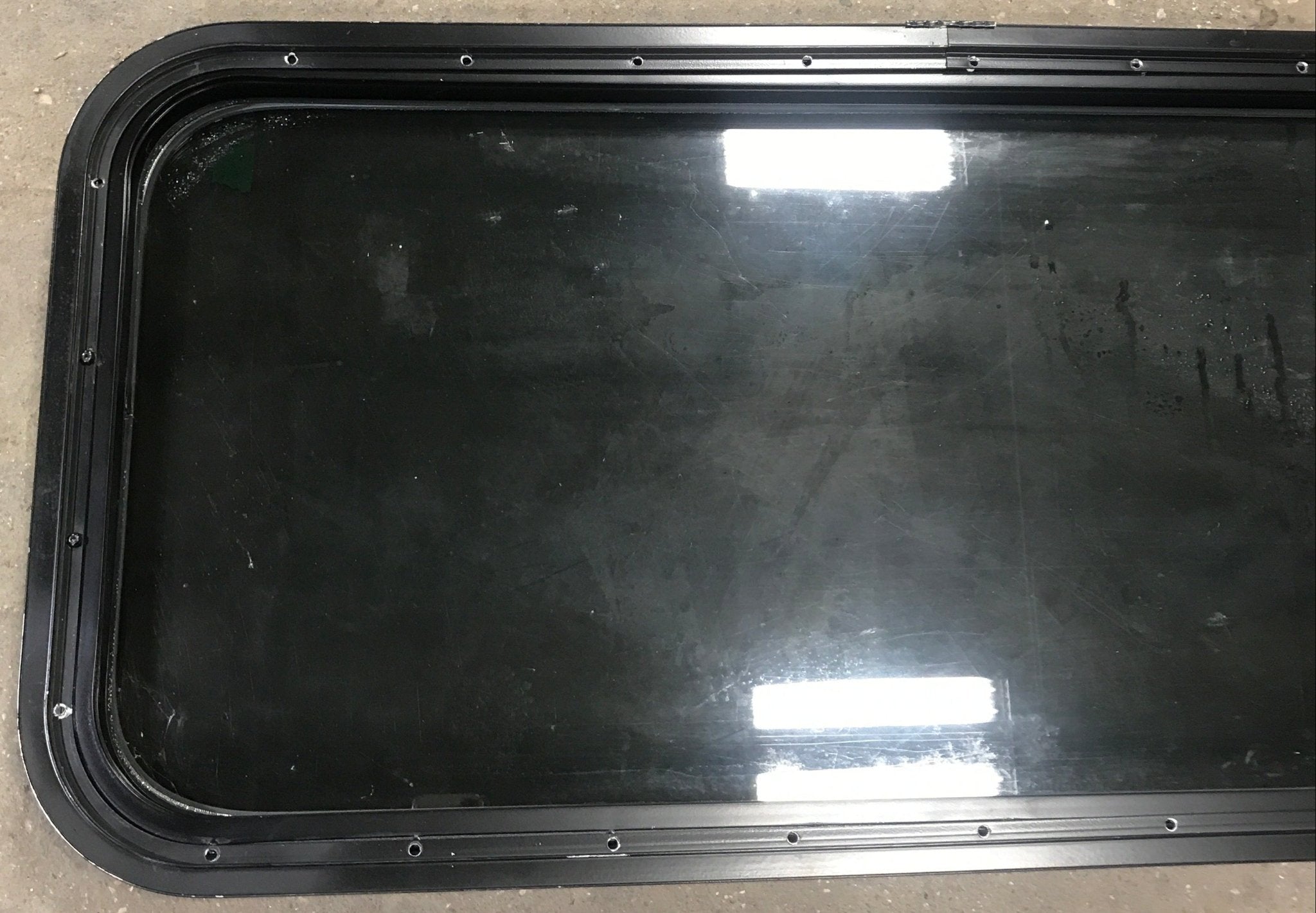Used Black Radius Non Opening Window : 17 1/2" W x 39 1/2" H x 1 7/8" D - Young Farts RV Parts