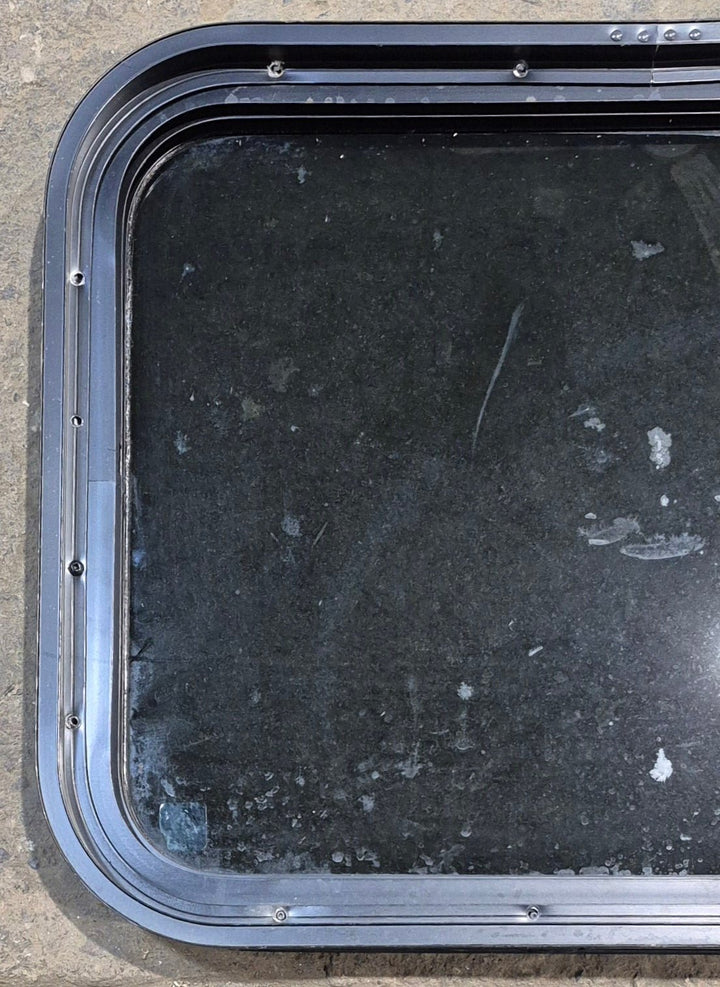 Used Black Radius Non Opening Window : 23 1/2" W x 17 1/4" H x 1 3/4" - Young Farts RV Parts