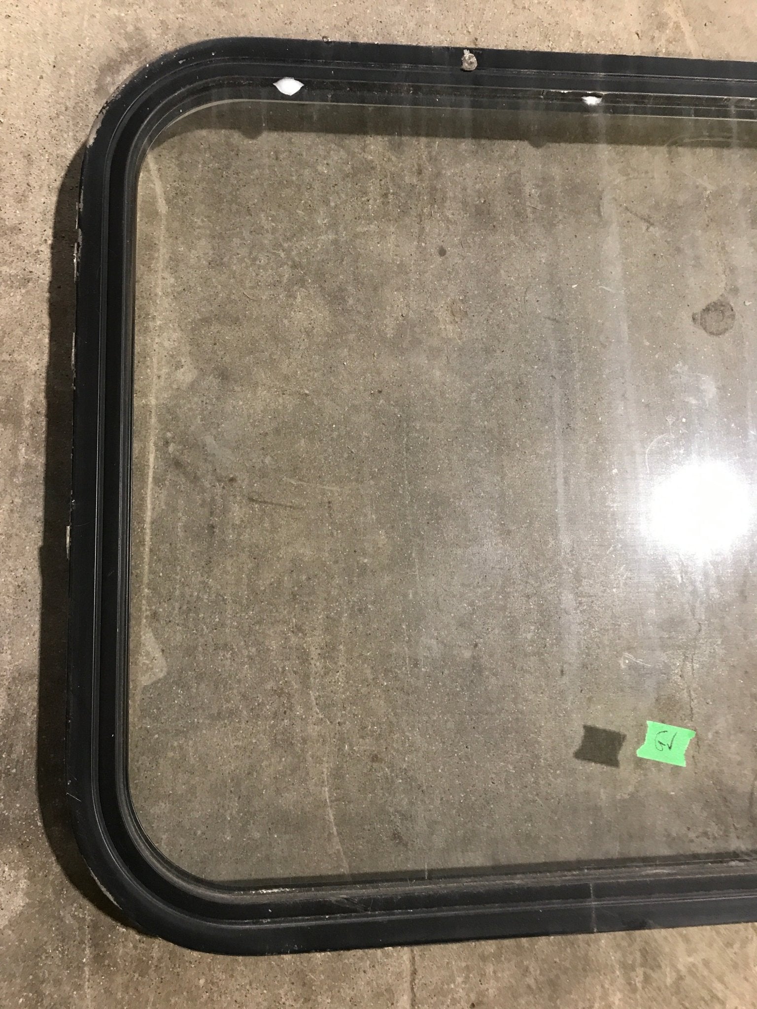 Used Black Radius Non Opening Window : 23 1/2" W x 22" H x 1 7/8" - Young Farts RV Parts