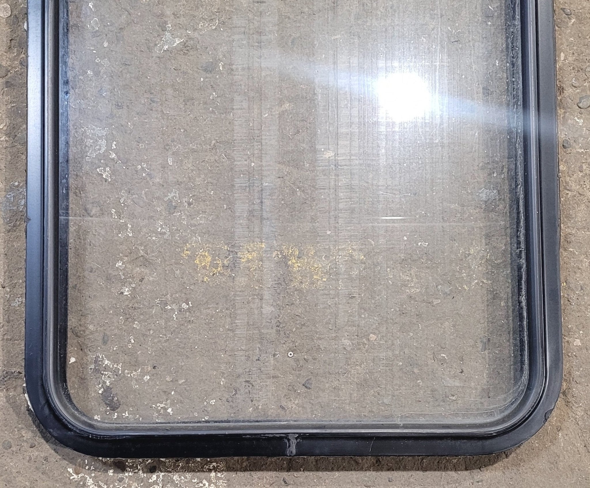 Used Black Radius Non Opening Window : 23 1/4" W x 34 3/4" H x 1 7/8" - Young Farts RV Parts