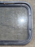 Used Black Radius Non Opening Window : 24 1/4" W x 16 3/4" H x 1 7/8" - Young Farts RV Parts