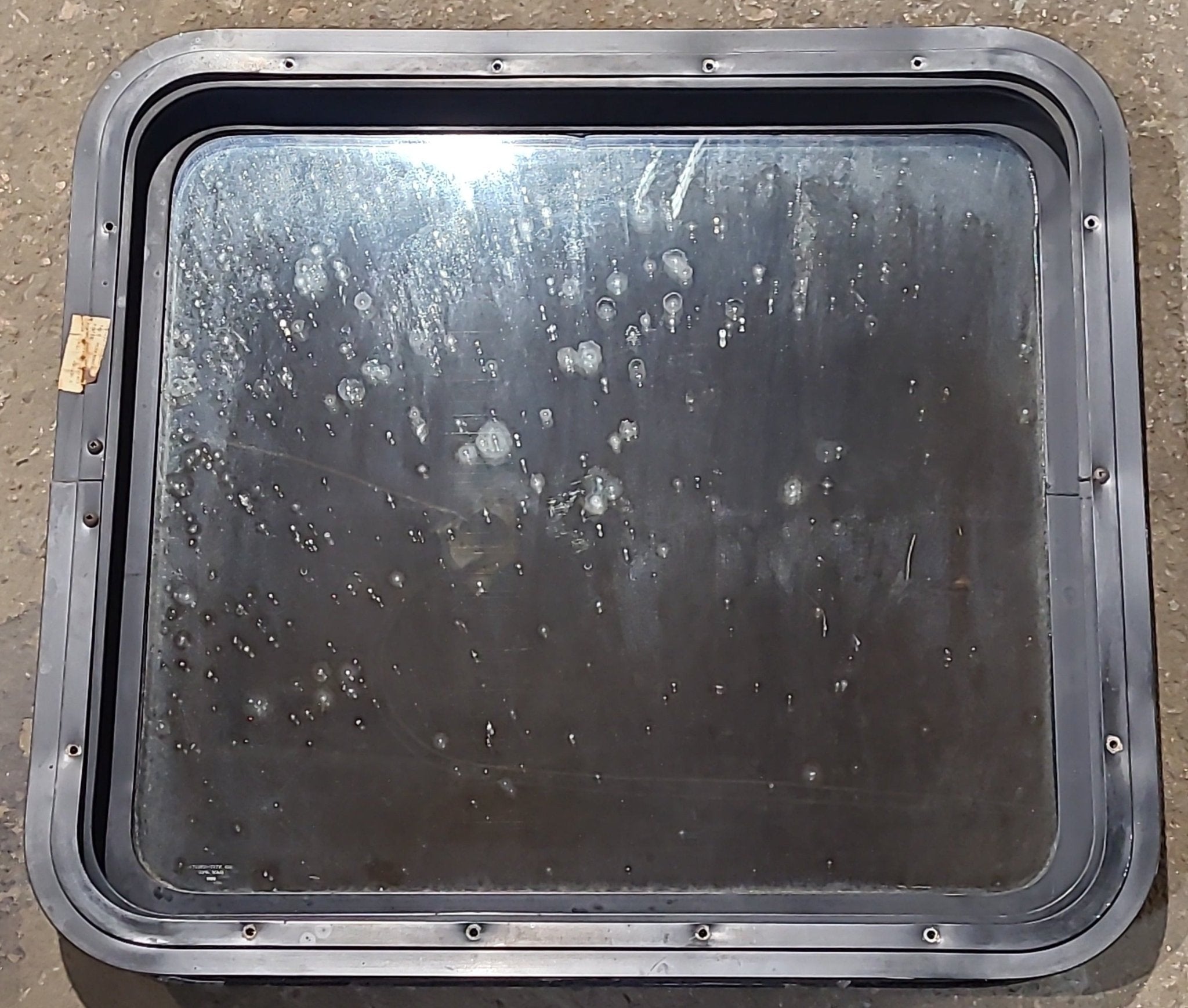 Used Black Radius Non Opening Window : 24" W x 21 1/2" H x 1 7/8" D - Young Farts RV Parts