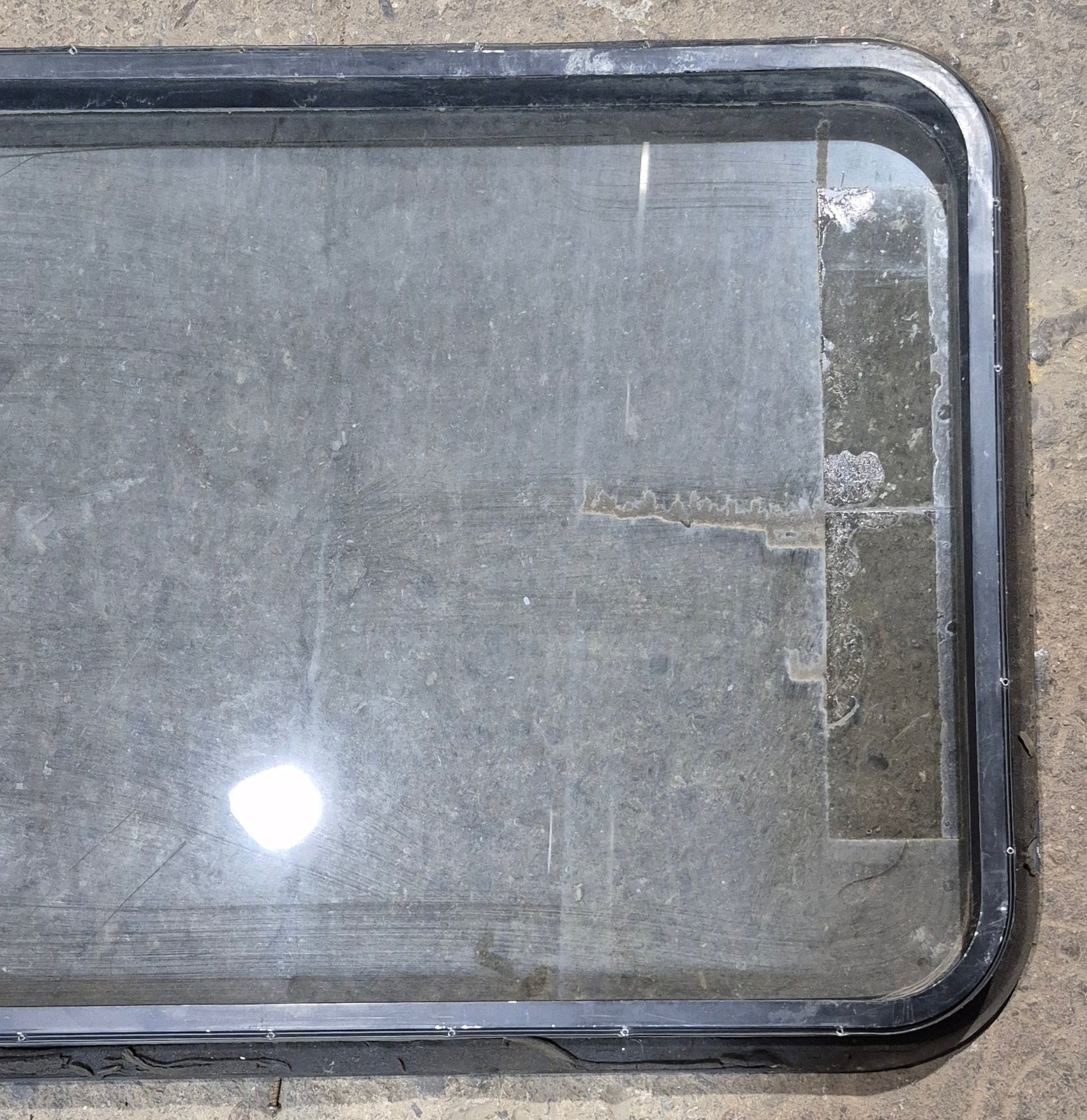 Used Black Radius Non - Opening Window : 34 1/4 x 23 1/4 x 1 1/2" D - Young Farts RV Parts