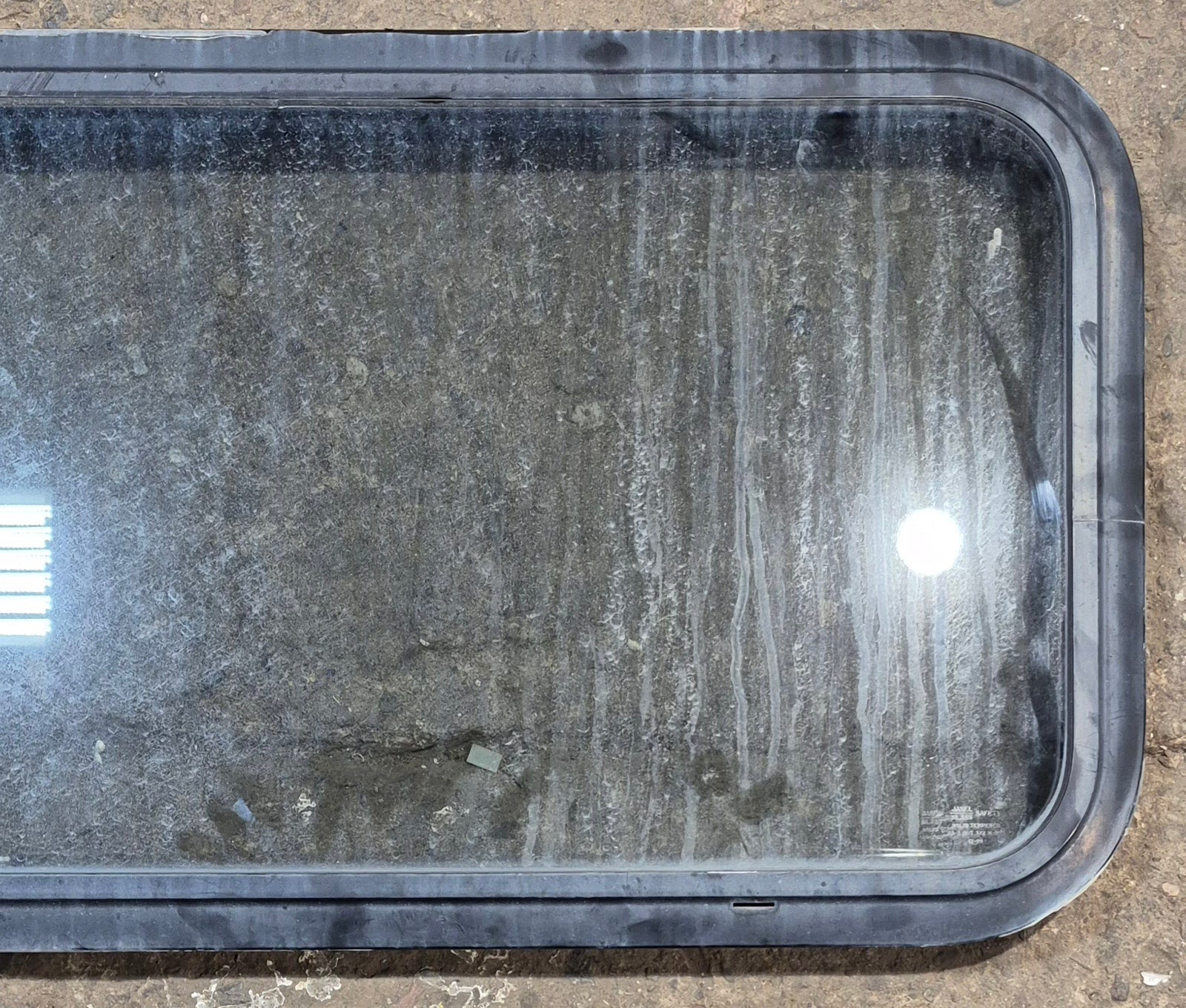 Used Black Radius Non Opening Window : 35 1/2" W x 17 1/2" H x 1 3/4" D - Young Farts RV Parts