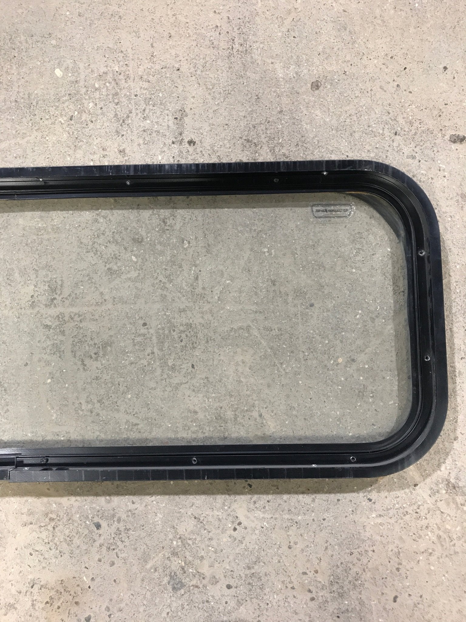 Used Black Radius Non Opening Window : 41 3/4" W x 14 3/4" H x 1 1/2" D - Young Farts RV Parts