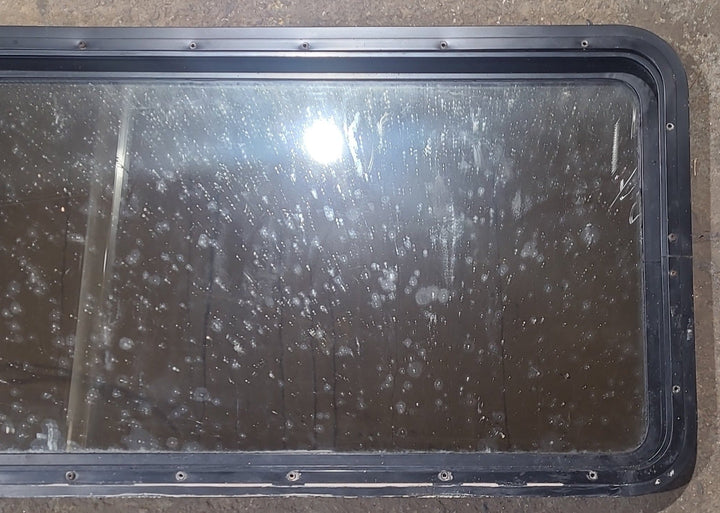 Used Black Radius Non Opening Window : 47 1/2" W x 21 1/2" H x 1 3/4" D - Young Farts RV Parts