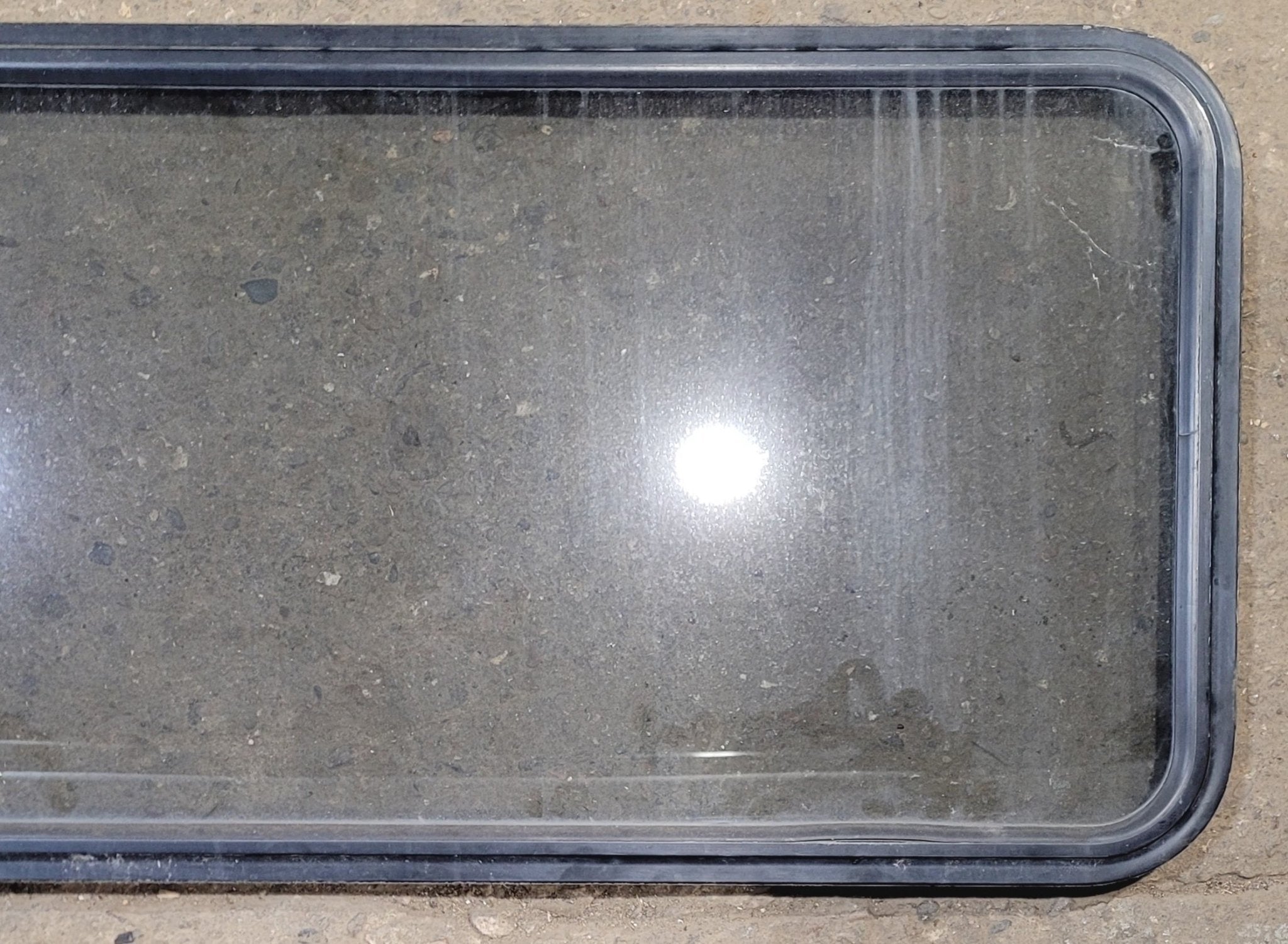 Used Black Radius Non Opening Window : 57 1/2" W x 21 1/2" H x 1 1/4" - Young Farts RV Parts