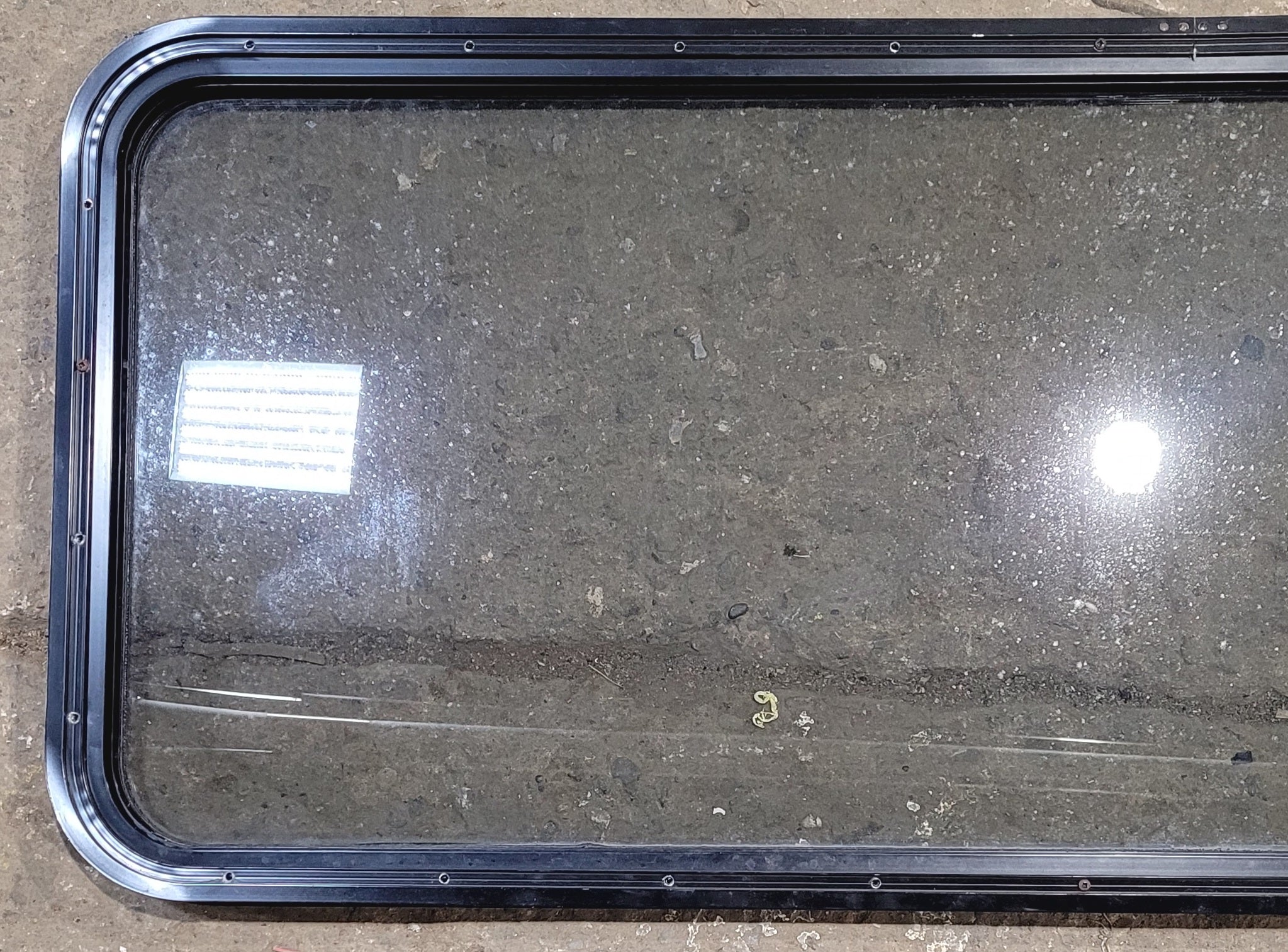 Used Black Radius Non Opening Window : 57 1/2" W x 21 1/2" H x 1 1/4" - Young Farts RV Parts