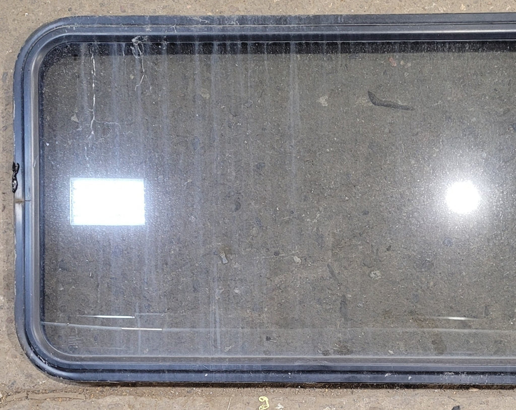 Used Black Radius Non Opening Window : 57 1/2" W x 21 1/2" H x 1 1/4" - Young Farts RV Parts