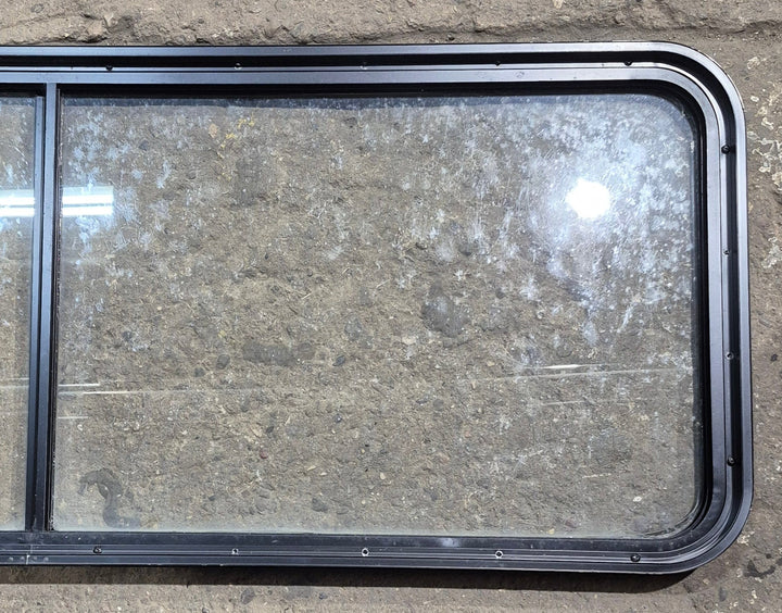 Used Black Radius Non Opening Window : 60 1/4" W x 21 3/4" H x 1 5/8" D - Young Farts RV Parts