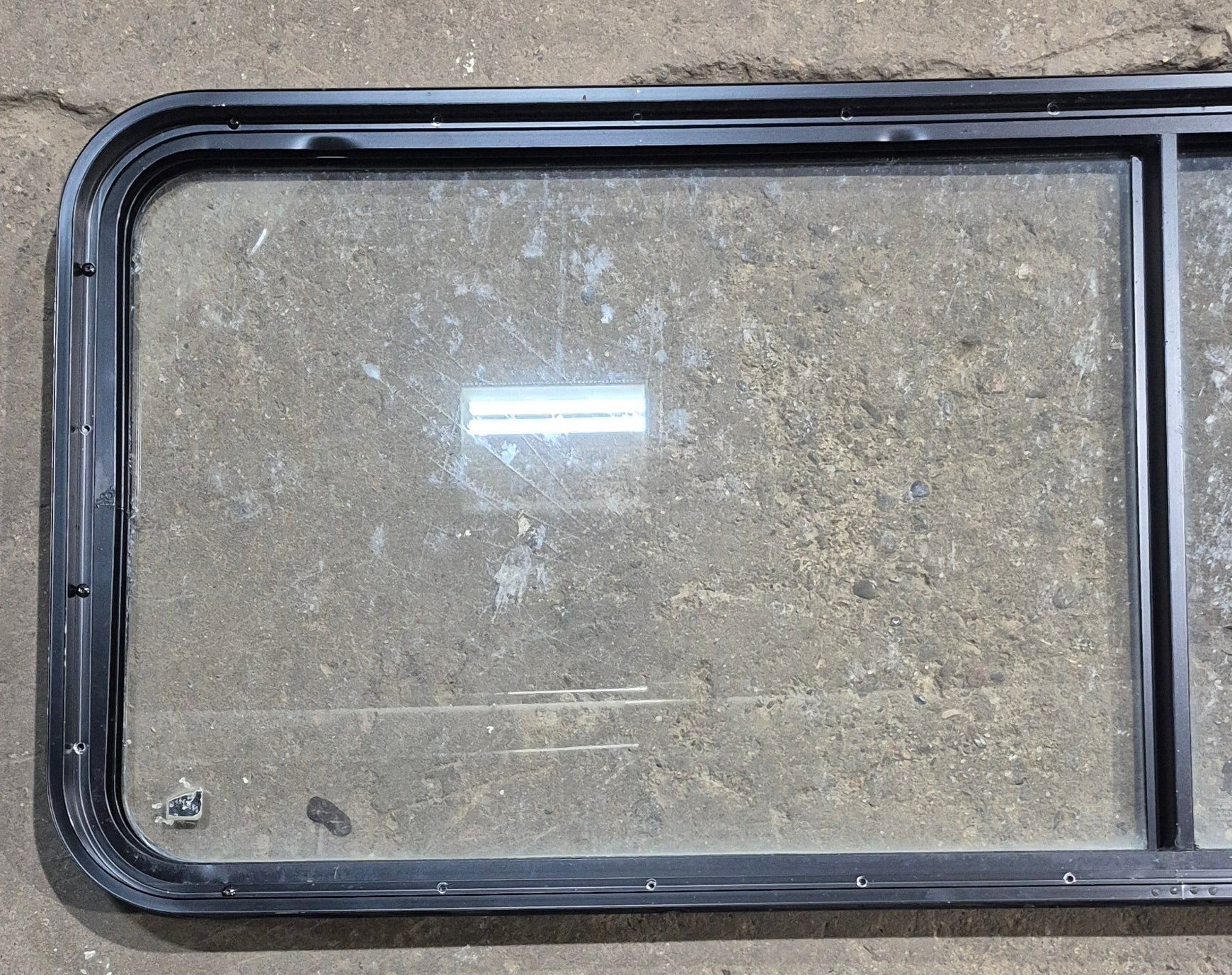 Used Black Radius Non Opening Window : 60 1/4" W x 21 3/4" H x 1 5/8" D - Young Farts RV Parts
