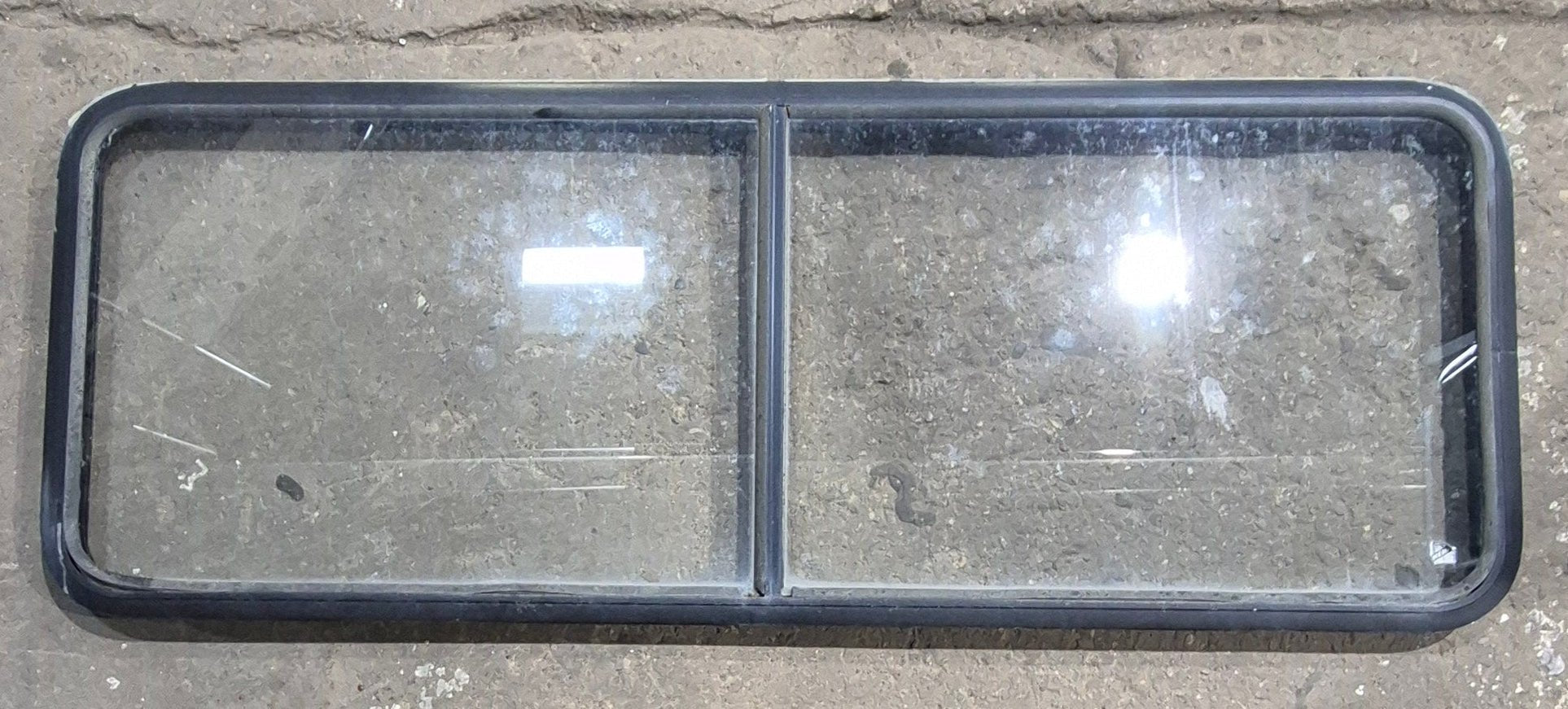 Used Black Radius Non Opening Window : 60 1/4" W x 21 3/4" H x 1 5/8" D - Young Farts RV Parts