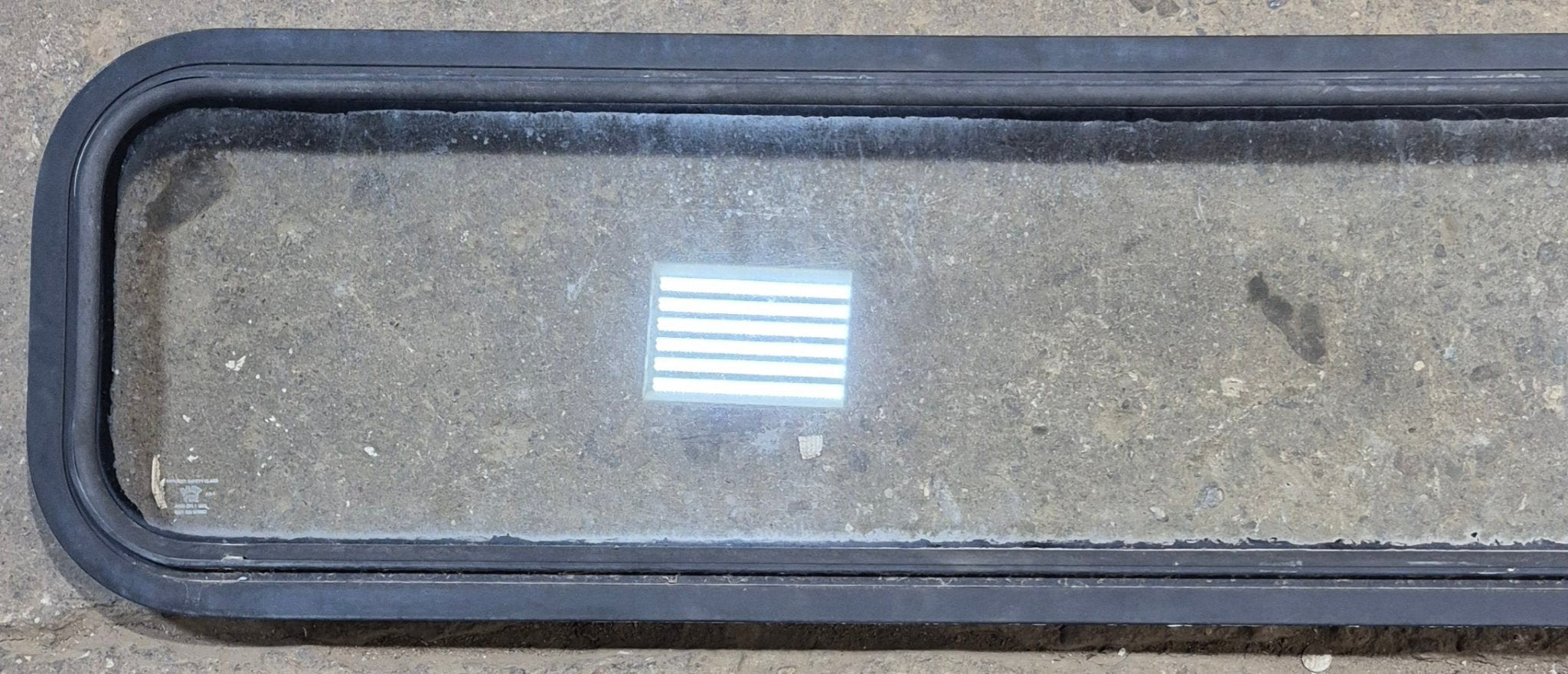 Used Black Radius Non Opening Window : 72 1/4" W x 11 3/4" H x 1 7/8" - Young Farts RV Parts