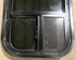 Used Black Radius Opening Window : 13 1/2" W x 25 1/2" H x 1 7/8" D - Young Farts RV Parts