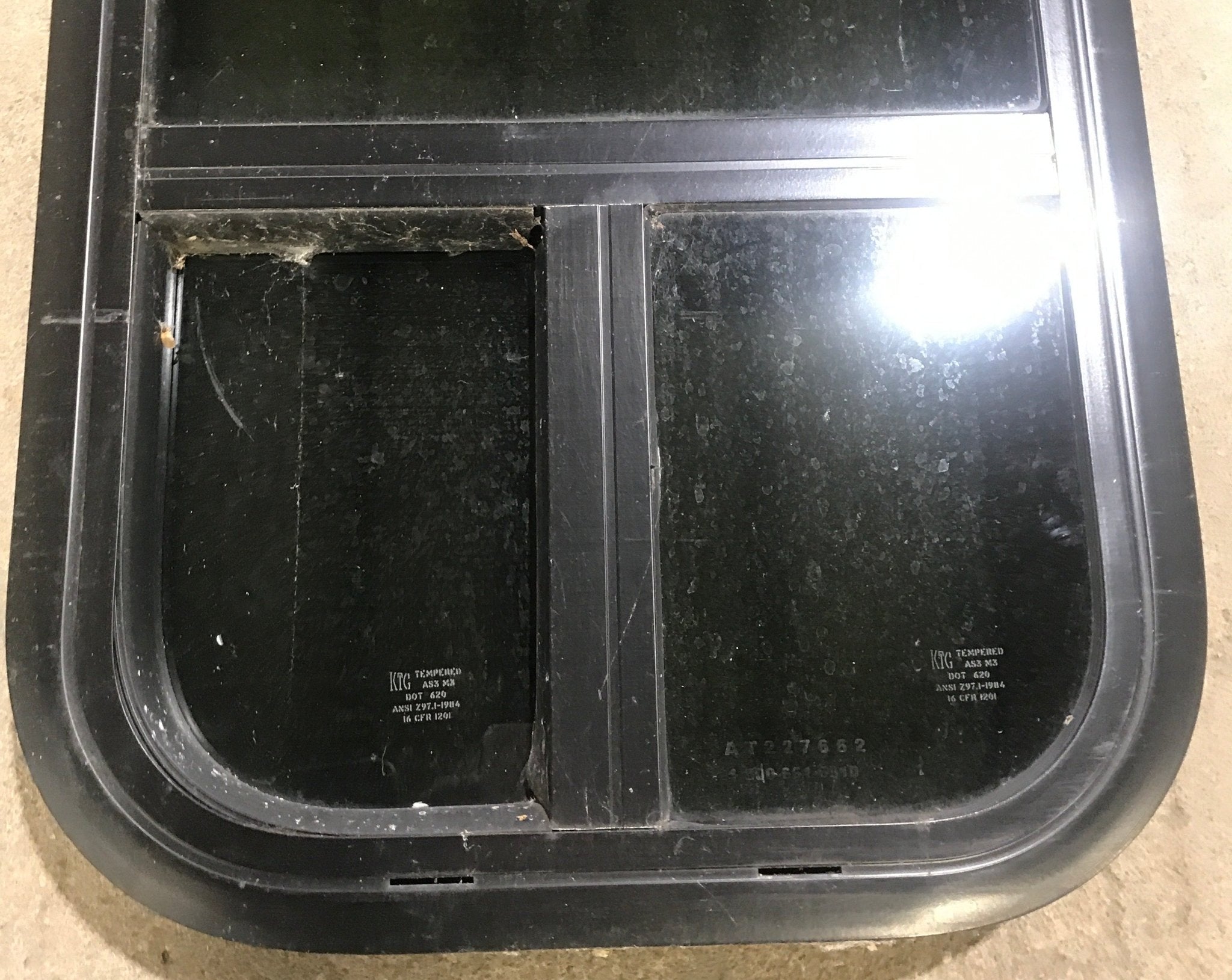 Used Black Radius Opening Window : 13 1/2" W x 25 1/2" H x 1 7/8" D - Young Farts RV Parts