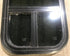 Used Black Radius Opening Window : 13 1/2" W x 25 1/2" H x 1 7/8" D - Young Farts RV Parts