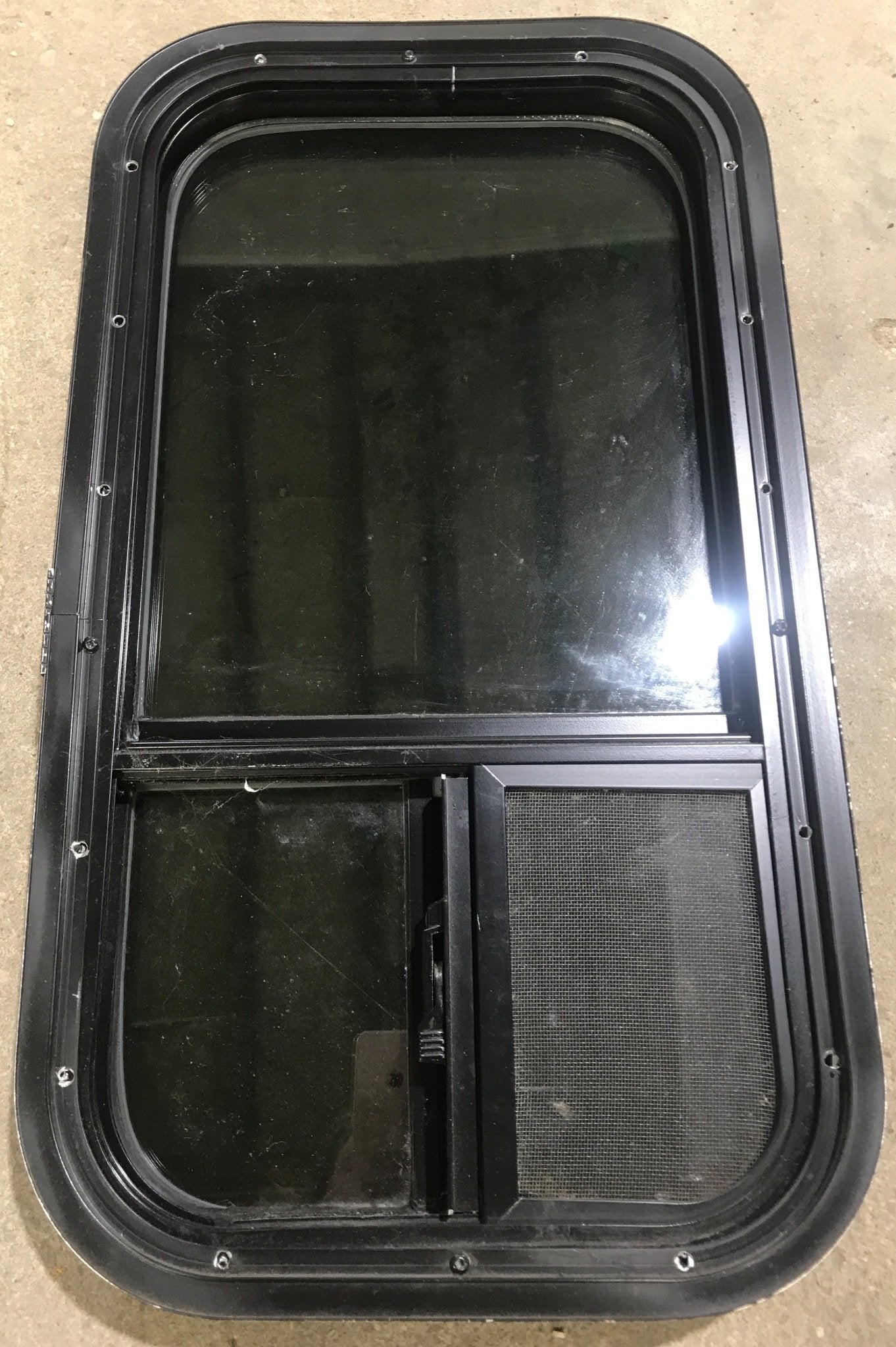 Used Black Radius Opening Window : 13 1/2" W x 25 1/2" H x 1 7/8" D - Young Farts RV Parts