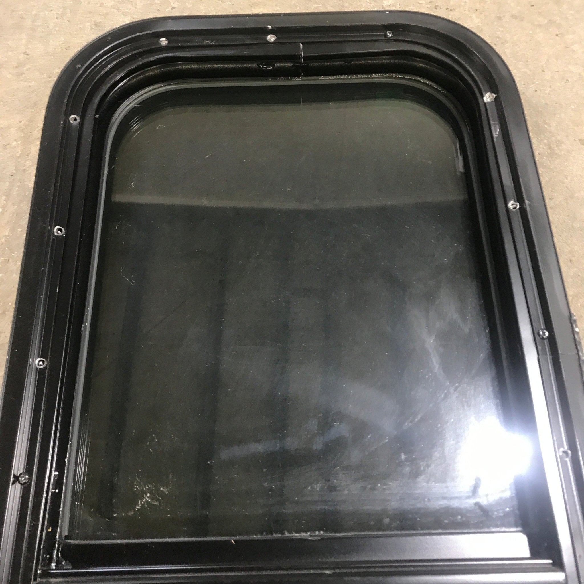 Used Black Radius Opening Window : 13 1/2" W x 25 1/2" H x 1 7/8" D - Young Farts RV Parts