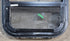 Used Black Radius Opening Window : 15 1/4" W x 15 1/4" H x 1 3/8" D - Young Farts RV Parts