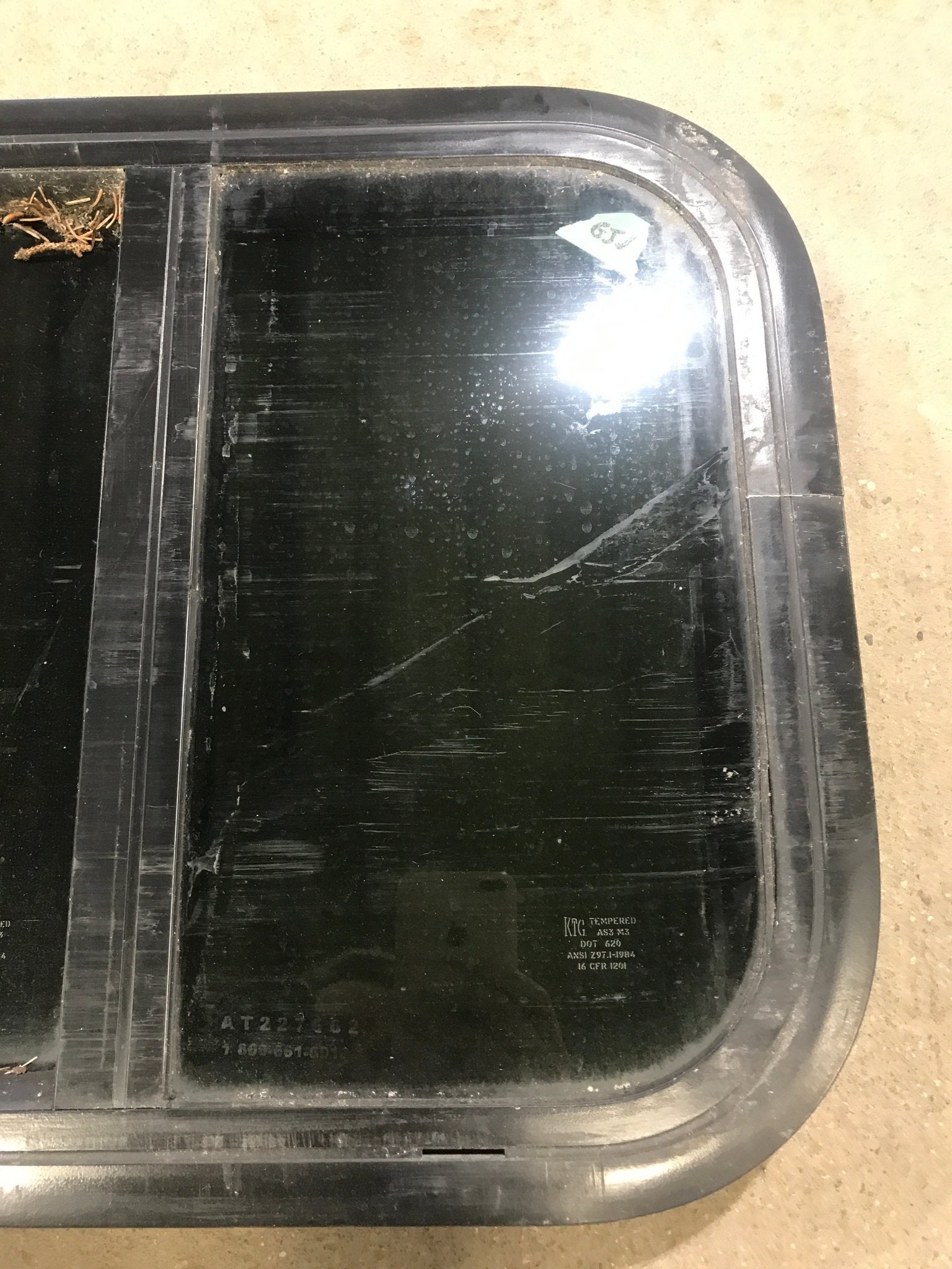 Used Black Radius Opening Window : 17 1/2" W x 14 1/2" H x 1 7/8" D - Young Farts RV Parts