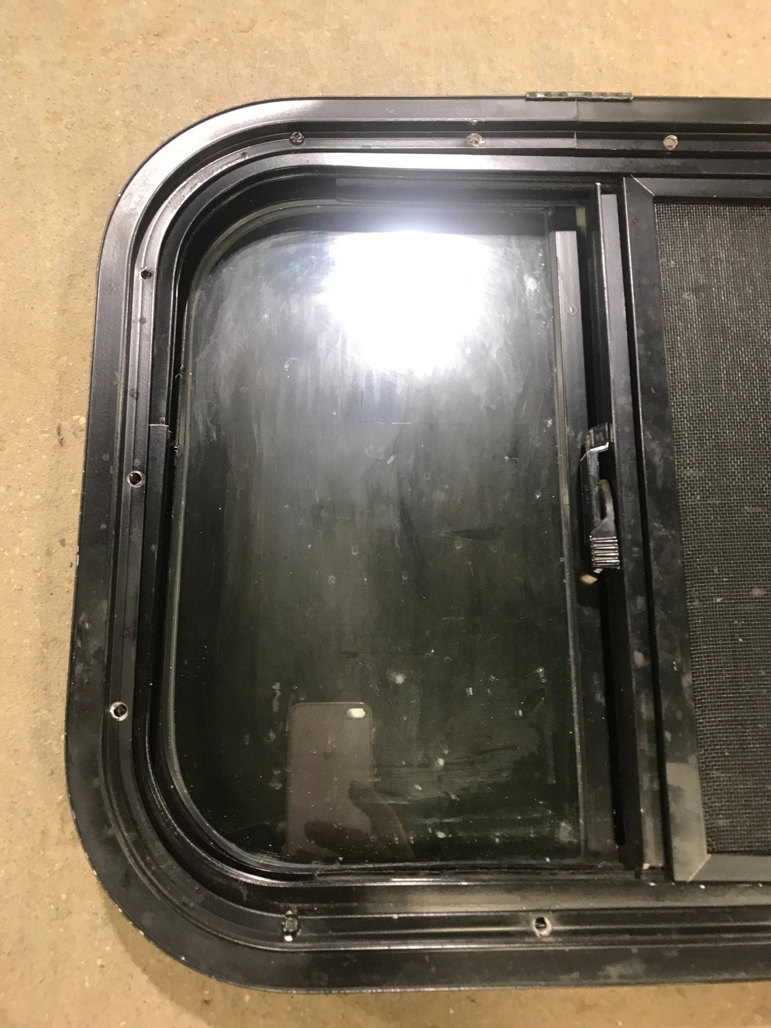 Used Black Radius Opening Window : 17 1/2" W x 14 1/2" H x 1 7/8" D - Young Farts RV Parts