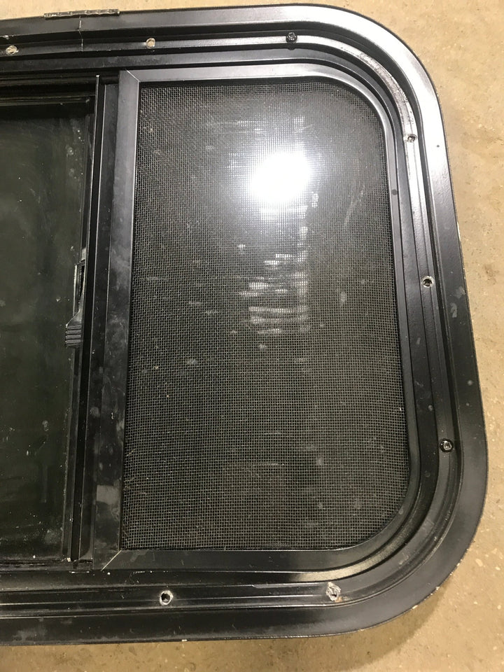 Used Black Radius Opening Window : 17 1/2" W x 14 1/2" H x 1 7/8" D - Young Farts RV Parts