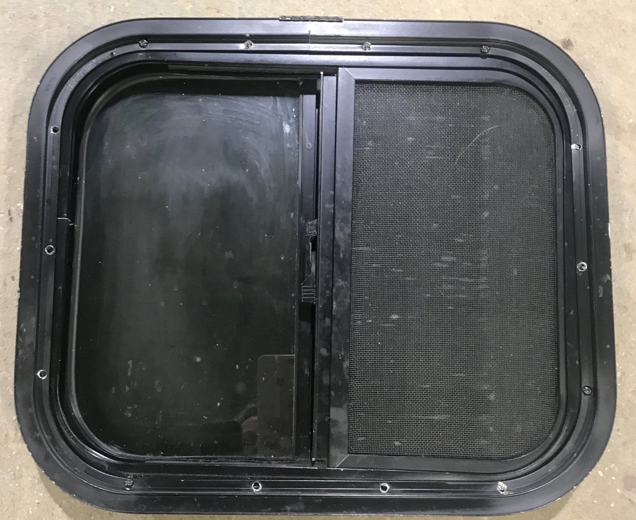 Used Black Radius Opening Window : 17 1/2" W x 14 1/2" H x 1 7/8" D - Young Farts RV Parts