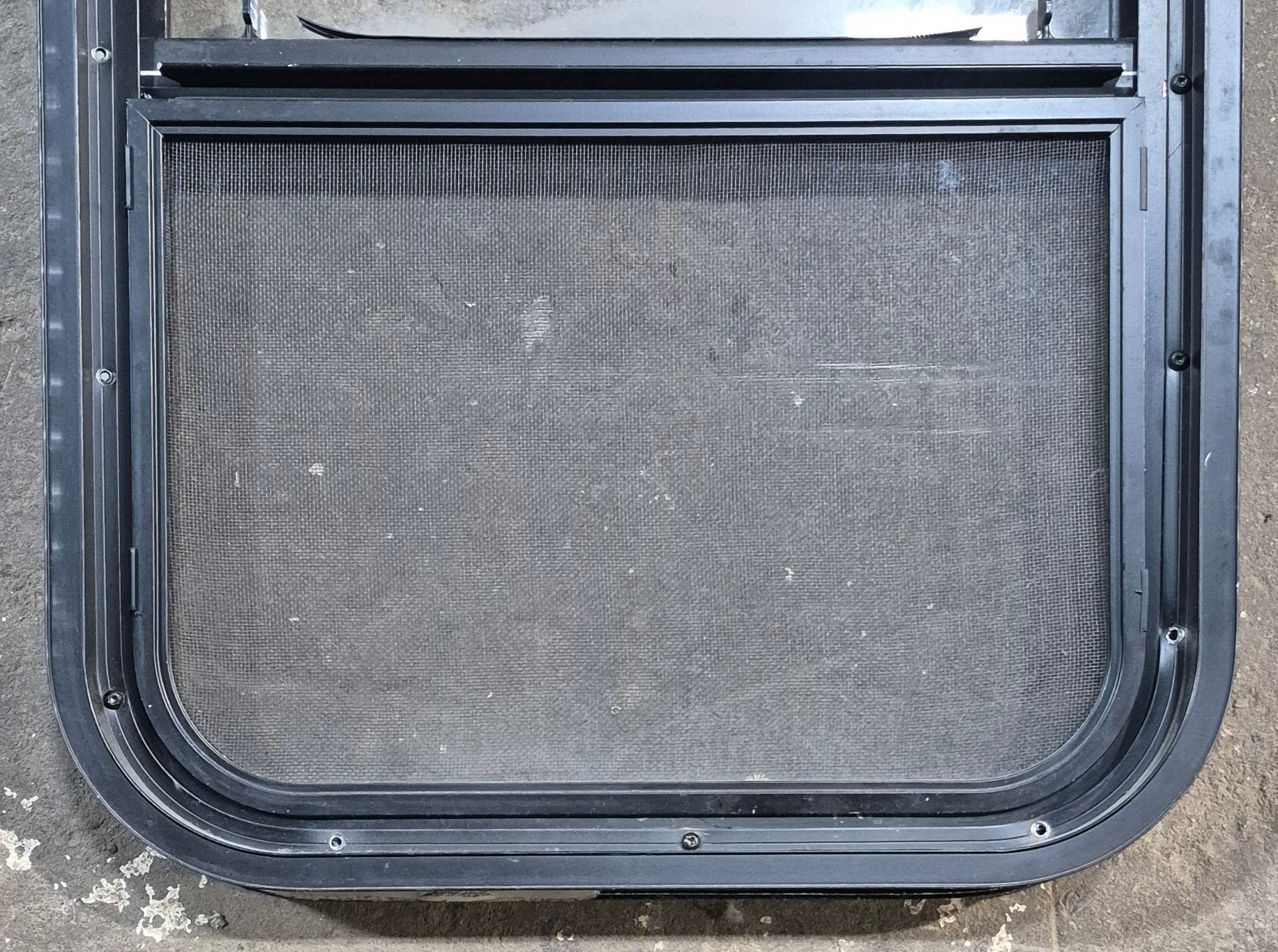 Used Black Radius Opening Window : 17 1/2" W x 25 1/4" H x 1 7/8" D - Young Farts RV Parts