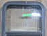 Used Black Radius Opening Window : 17 1/2" W x 25 1/4" H x 1 7/8" D - Young Farts RV Parts