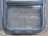 Used Black Radius Opening Window : 17 1/2" W x 25 1/4" H x 1 7/8" D - Young Farts RV Parts