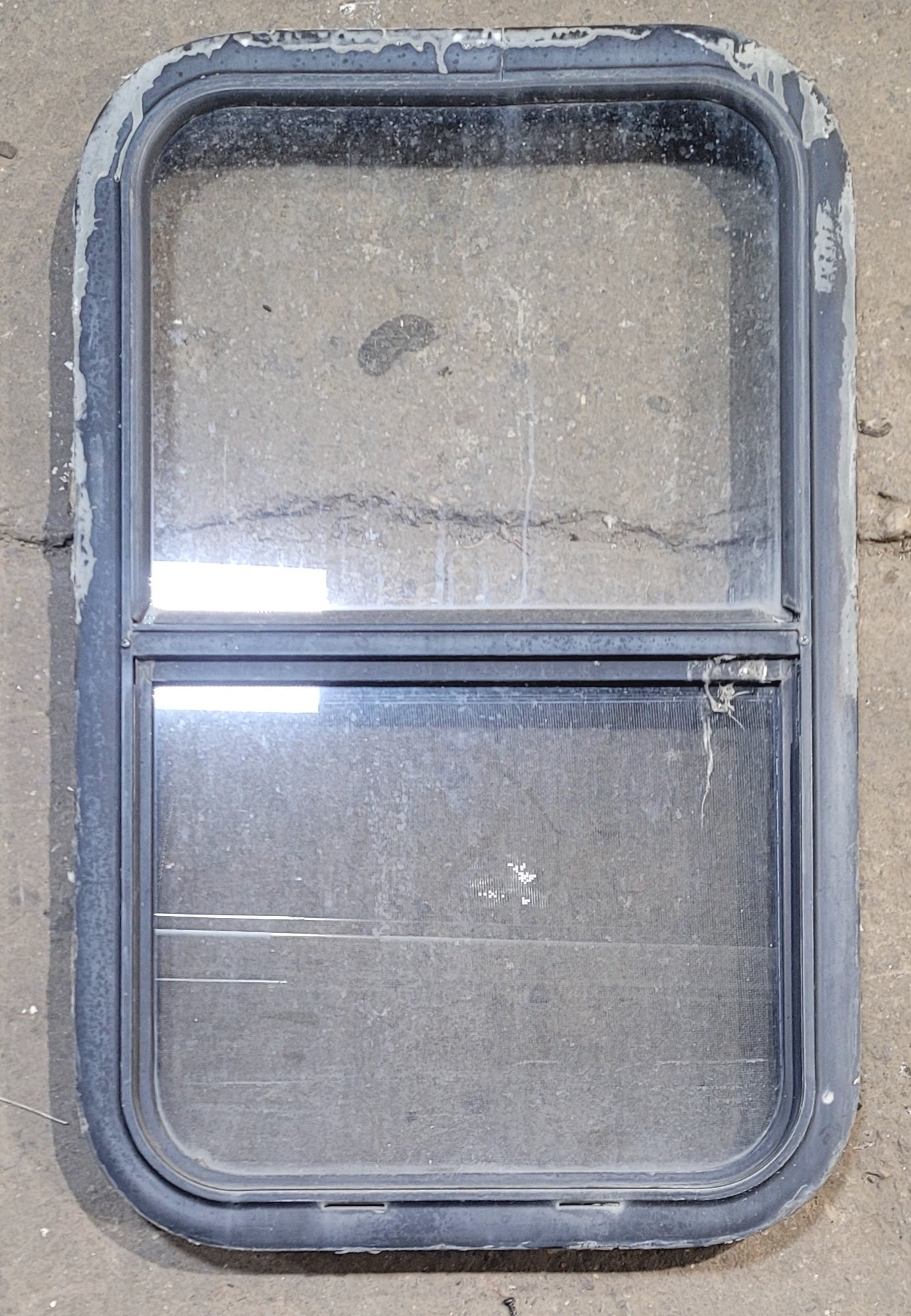 Used Black Radius Opening Window : 17 1/2" W x 28 1/2" H x 1 7/8" - Young Farts RV Parts