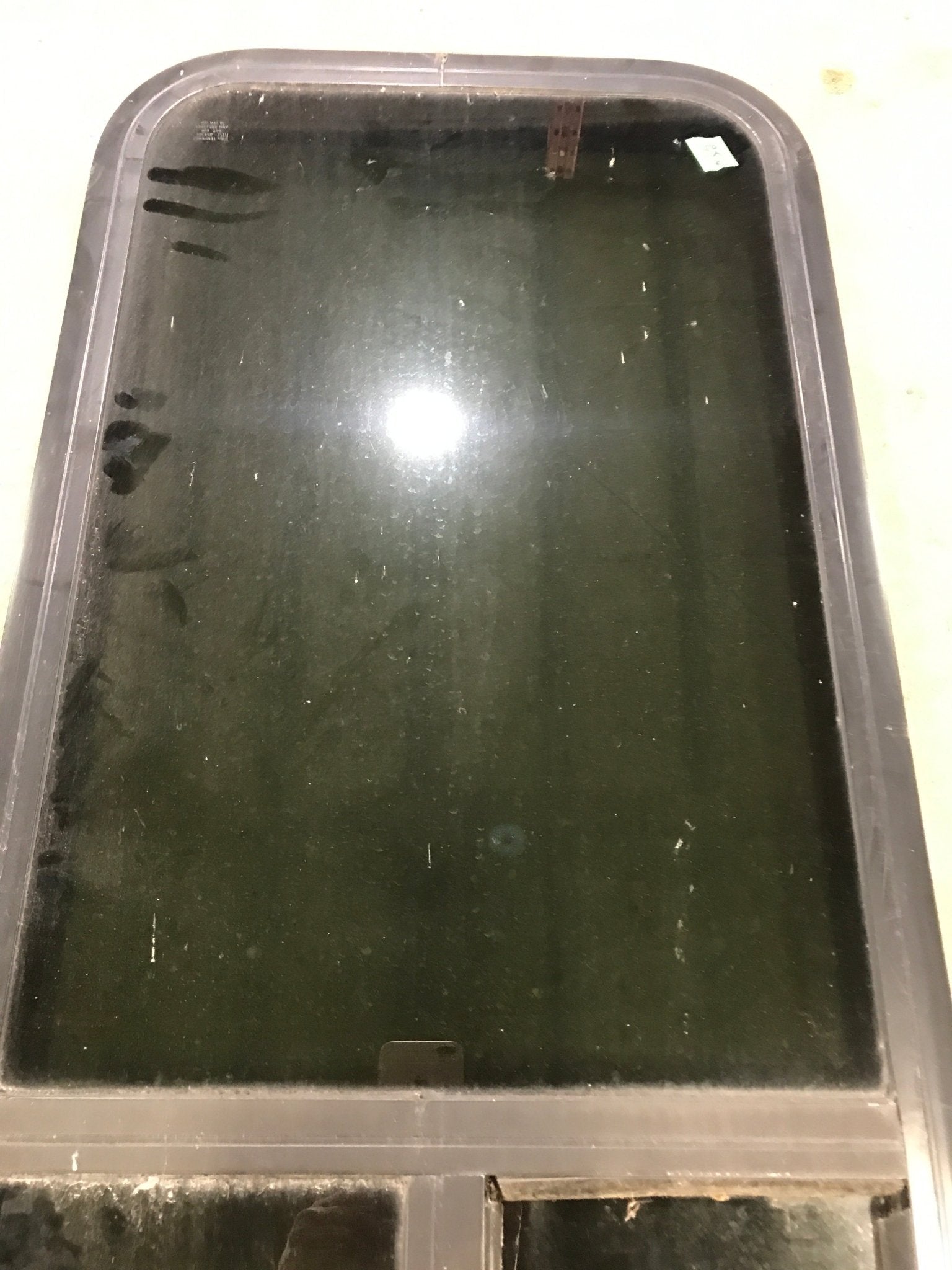 Used Black Radius Opening Window : 17 1/2" W x 39 1/2" H x 1 7/8" D - Young Farts RV Parts
