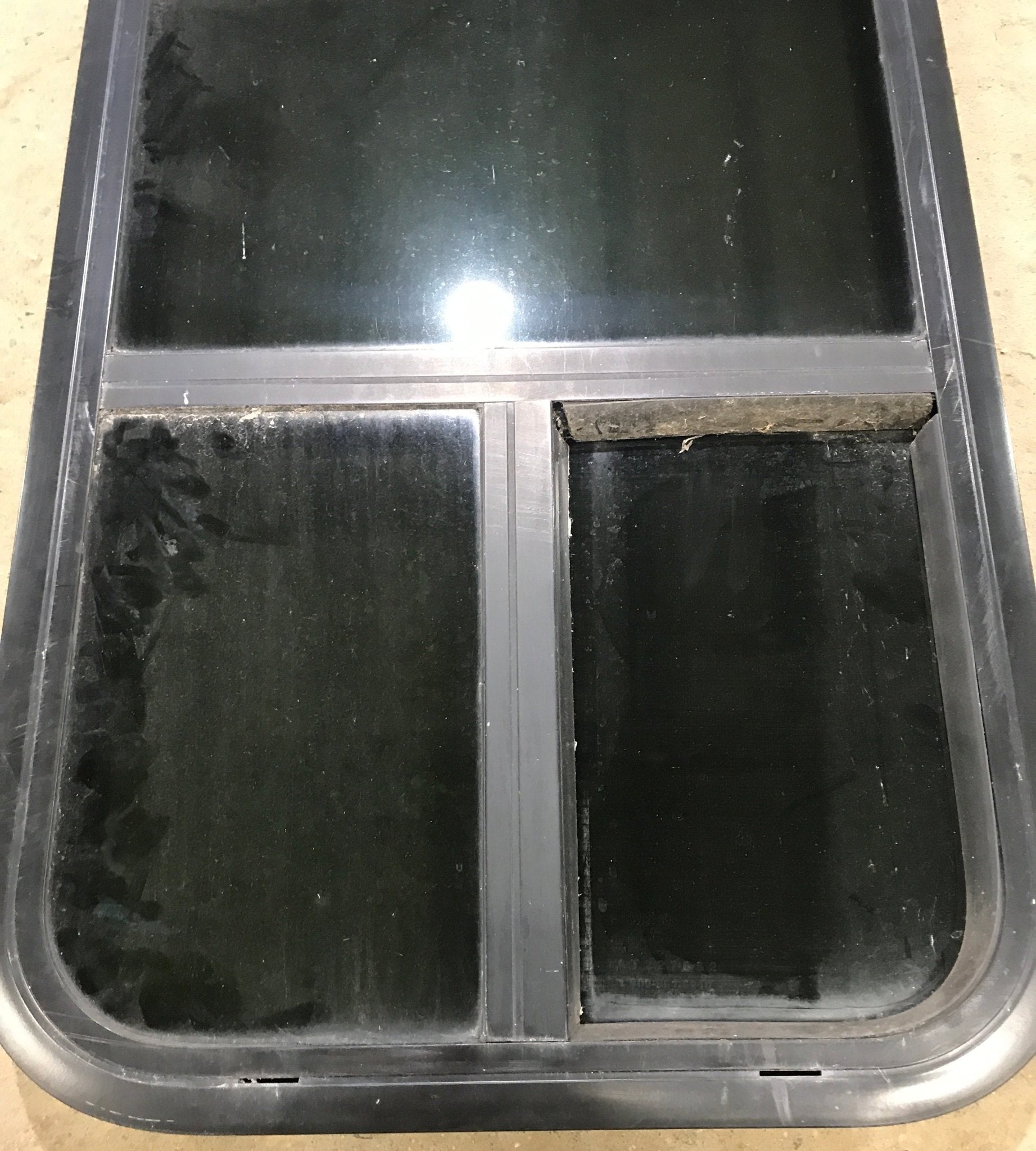 Used Black Radius Opening Window : 17 1/2" W x 39 1/2" H x 1 7/8" D - Young Farts RV Parts