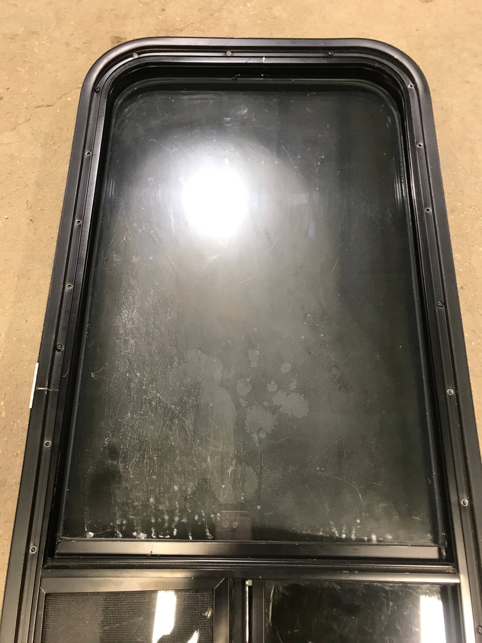 Used Black Radius Opening Window : 17 1/2" W x 39 1/2" H x 1 7/8" D - Young Farts RV Parts