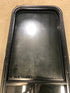 Used Black Radius Opening Window : 17 1/2" W x 39 1/2" H x 1 7/8" D - Young Farts RV Parts