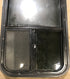Used Black Radius Opening Window : 17 1/2" W x 39 1/2" H x 1 7/8" D - Young Farts RV Parts