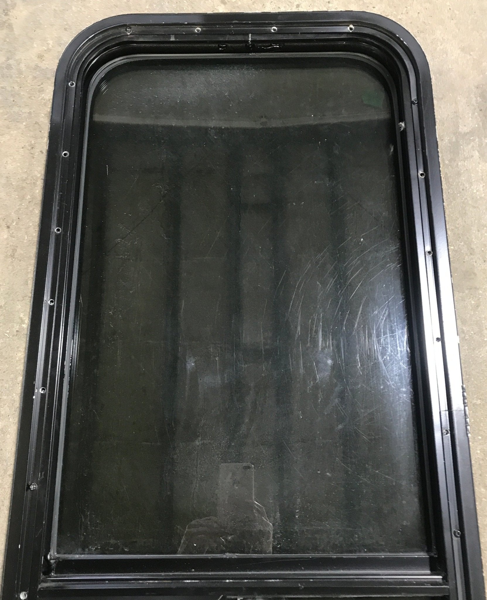 Used Black Radius Opening Window : 17 1/2" W x 39 1/2" H x 1 7/8" D - Young Farts RV Parts